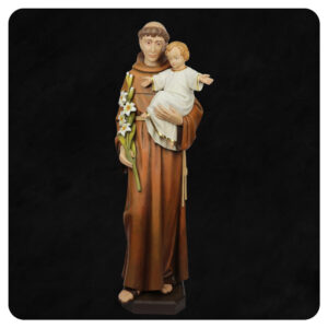 Święty Antoni wykonany w drenie lipowym. Postać z Dzieciątkiem na ręce oraz liliami