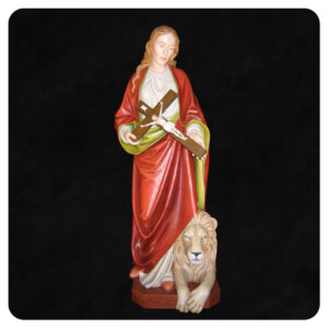 Tekla - rzeźbiona postać świętej przedstawiona z krzyżem i lwem