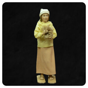 Postać dziewczynki, rzeźbiona z materiałowymi ubraniami do szopki bożonarodzeniowej